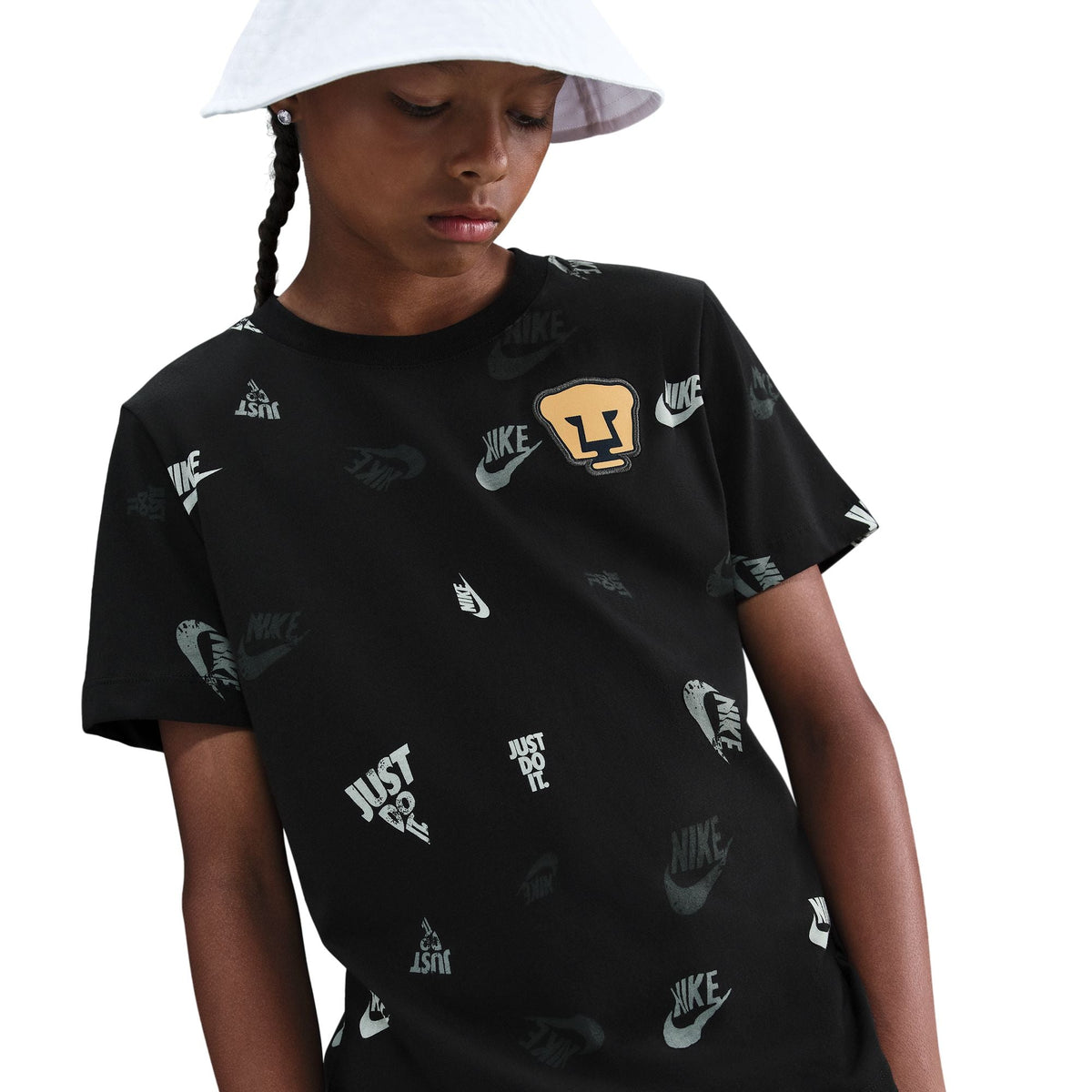 PUMAS UNAM x Nike Crest AOP T-Shirt product image 1, provided for visual reference and product detail review